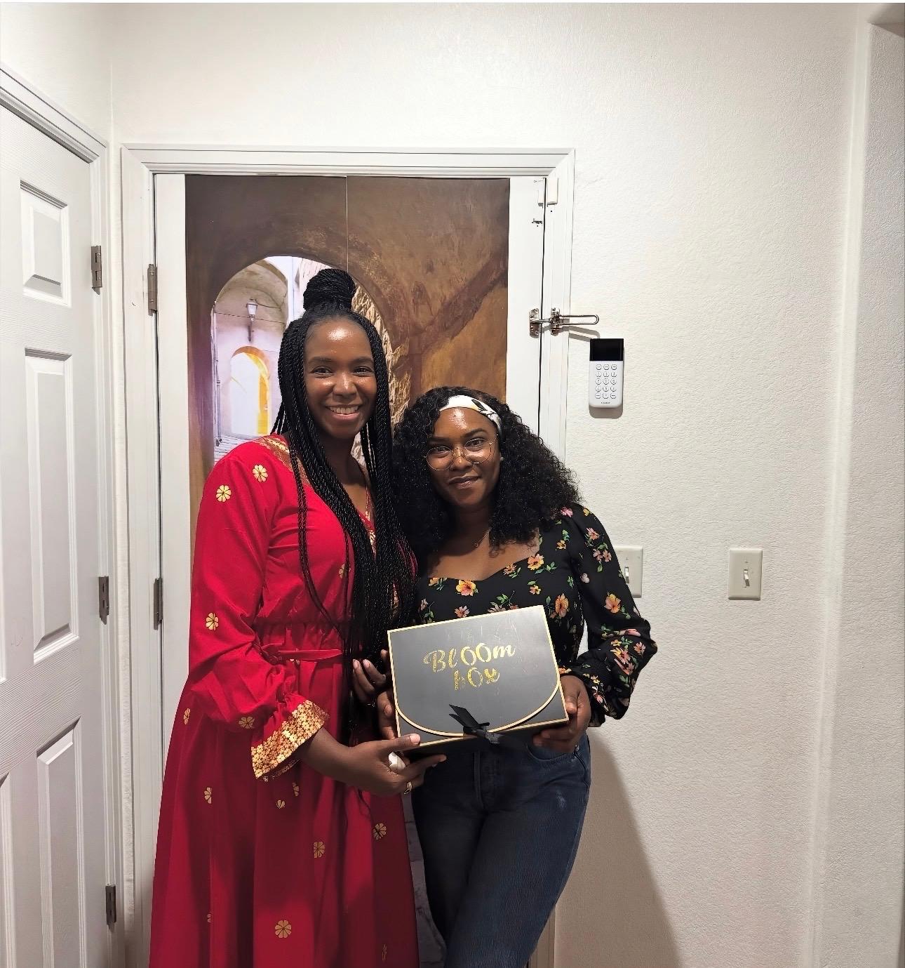 Two women celebrating with their Bloom Box - a moment of joy and connection